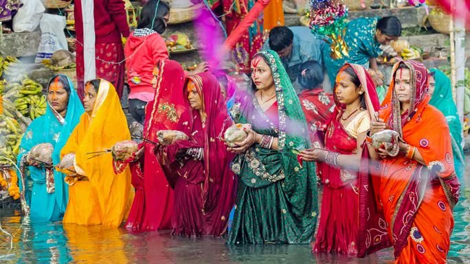Devotees offering prayers to the Sun God during Chhat Parva in Nepal. 