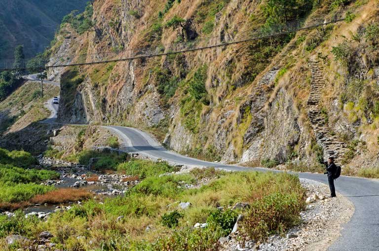 Black topped road on hike to the historic route of Chandragiri-Chitlang-Kulekhani.