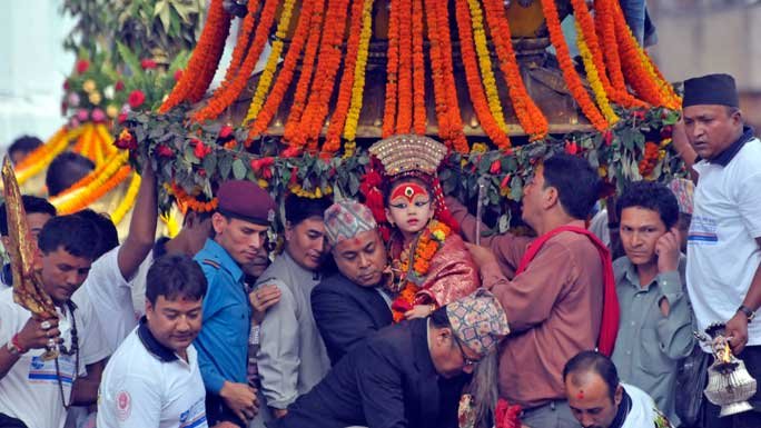 Living Goddess Kumari being carried on a palanquin during the Indra Jatra festival in Kathmandu, Nepal. 