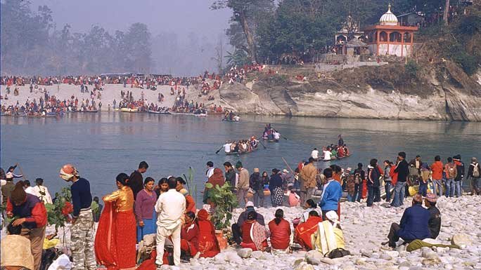 Hindu devotees during Maghe Sankranti  taking or preparing to take the holy bath at Devghat, Chitwan, Nepal.