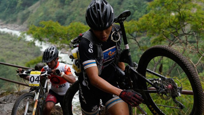 Bikers carrying their bikes during Yak Ru ® 2016 in Annapurna Circuit, Nepal. 