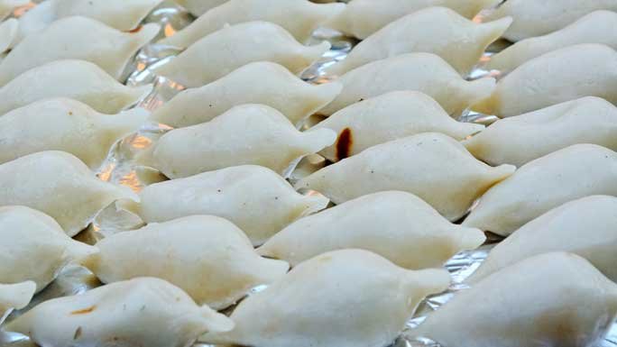 Fresh Yomari, a rice sweetmeat, filled with molasses and sesame seed, enjoyed by Newars of Kathmandu valley during Yomari Punhi, a harvest festival. 